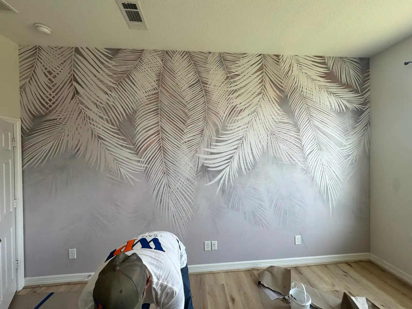 Colorful watercolor-style wallpaper mural on an interior wall